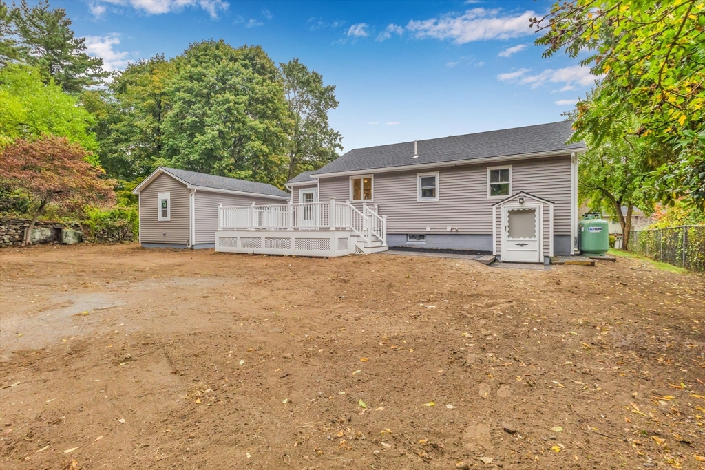 26 Navy Yard Road Dracut, MA 01826 - Photo 11 of 39 a house that has a tree in front of it