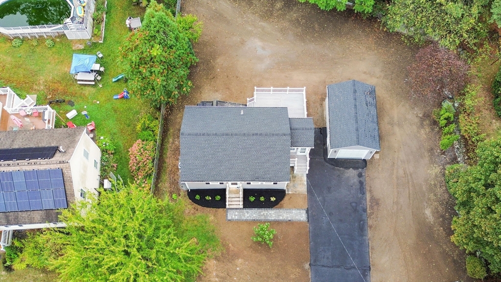 26 Navy Yard Road Dracut, MA 01826 - Photo 13 of 39 an aerial view of a house with outdoor space and trees all around