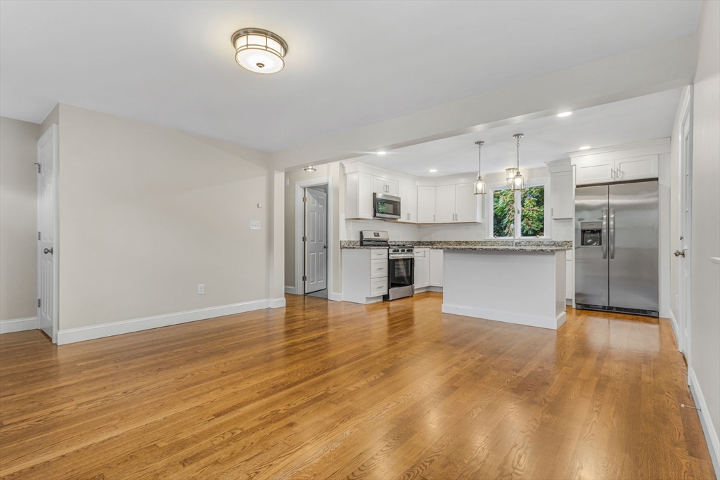 26 Navy Yard Road Dracut, MA 01826 - Photo 21 of 39 a view of kitchen with wooden floor