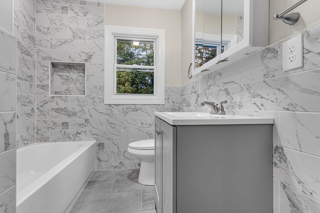26 Navy Yard Road Dracut, MA 01826 - Photo 24 of 39 a bathroom with a sink toilet and bathtub