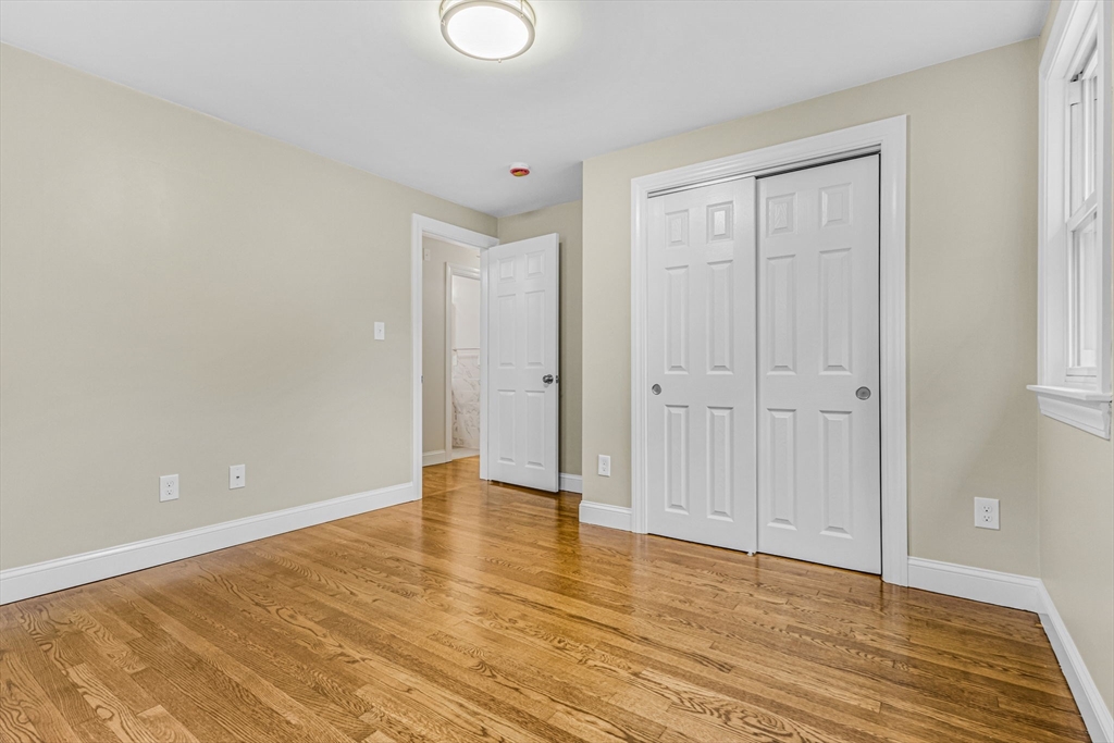 26 Navy Yard Road Dracut, MA 01826 - Photo 26 of 39 a view of an empty room with wooden floor