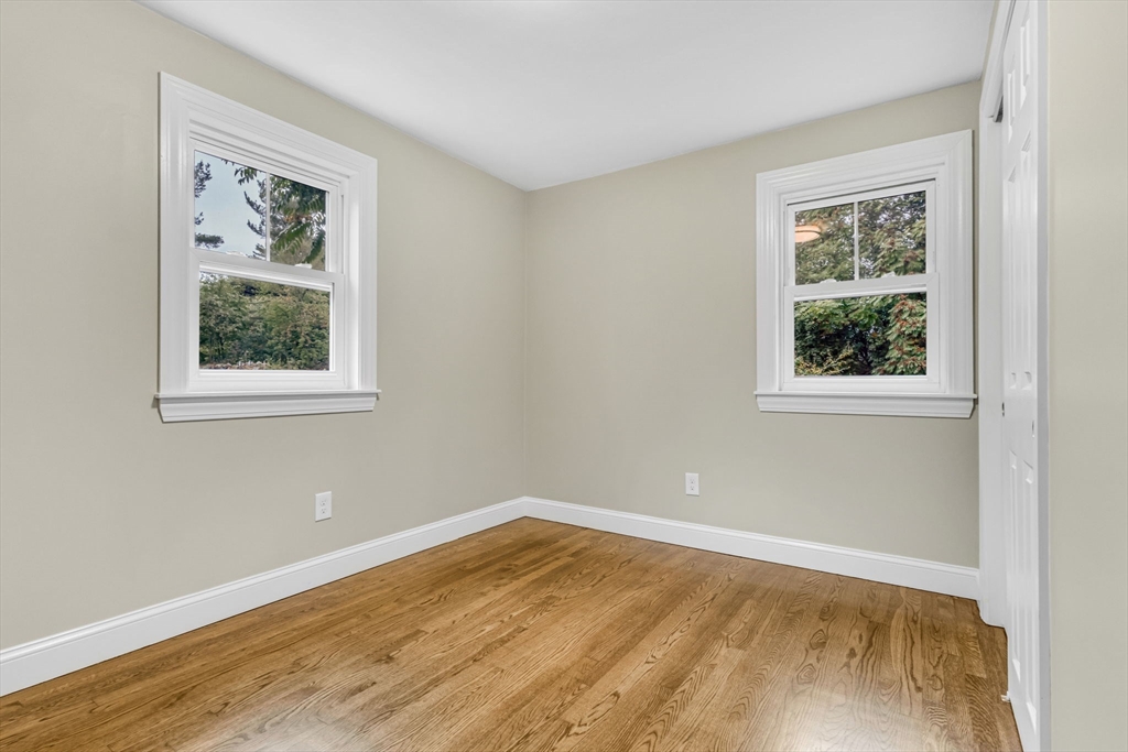 26 Navy Yard Road Dracut, MA 01826 - Photo 27 of 39 a view of a big room with wooden floor and windows
