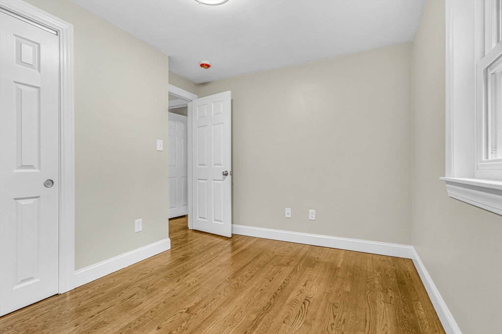 26 Navy Yard Road Dracut, MA 01826 - Photo 28 of 39 a view of an empty room with wooden floor and a window