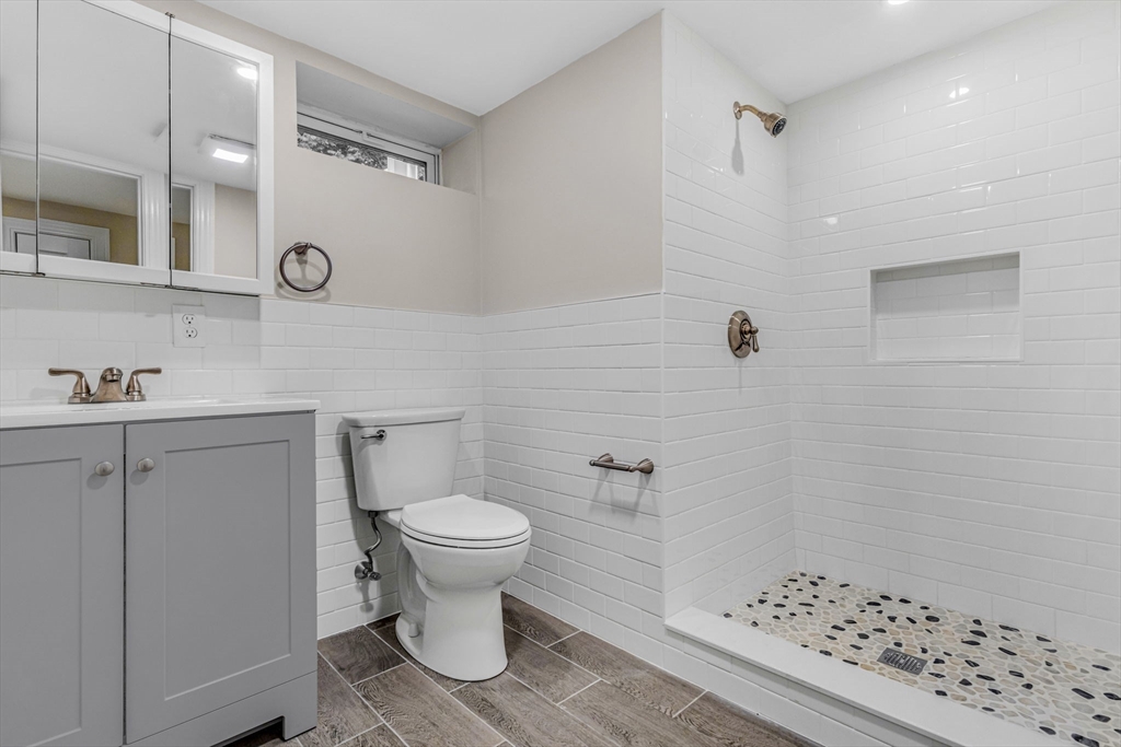 26 Navy Yard Road Dracut, MA 01826 - Photo 31 of 39 a bathroom with a sink toilet and shower