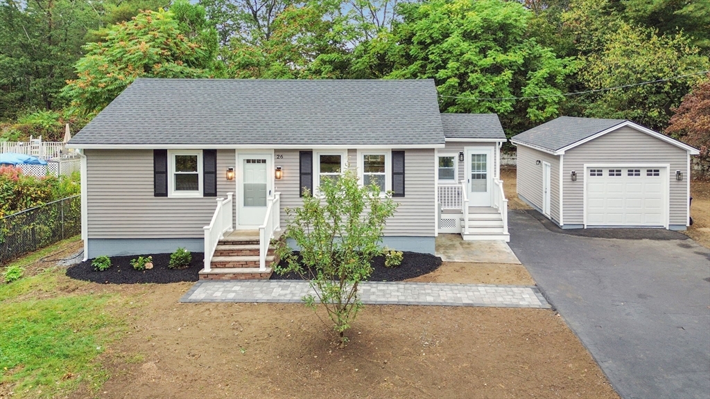 26 Navy Yard Road Dracut, MA 01826 - Photo 4 of 39 front view of a house with a yard