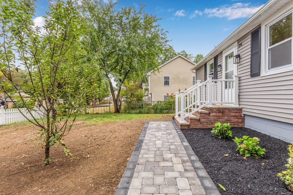 26 Navy Yard Road Dracut, MA 01826 - Photo 6 of 39 a view of a house with a yard