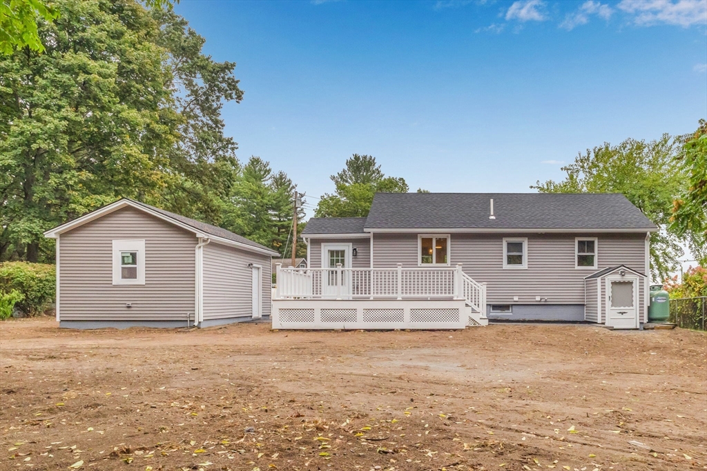26 Navy Yard Road Dracut, MA 01826 - Photo 10 of 39 front view of a house with a yard
