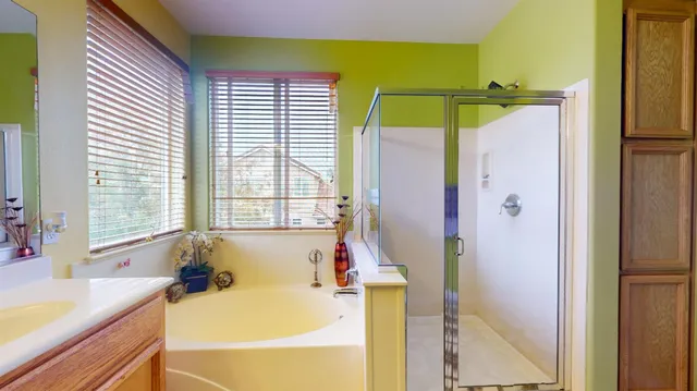 a bathroom with a tub and a sink