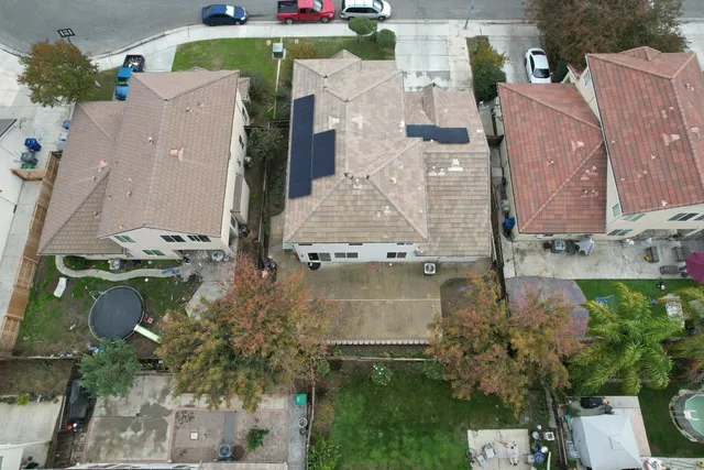 an aerial view of multiple houses with outdoor space