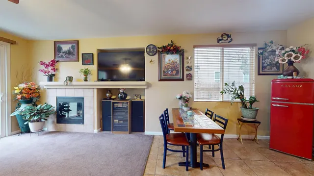 a view of a dining room with furniture and chandelier
