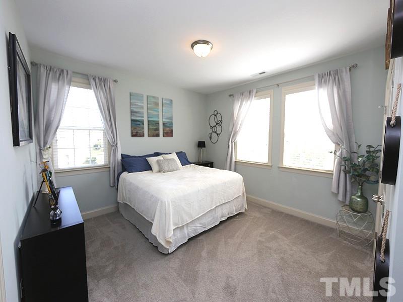 811 Chapanoke Road Raleigh, NC 27603 - Photo 15 of 25 a bedroom with a bed and a window