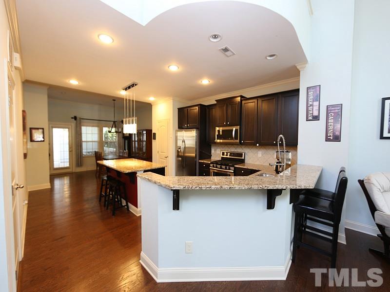 811 Chapanoke Road Raleigh, NC 27603 - Photo 6 of 25 a kitchen with a sink appliances and wooden floor