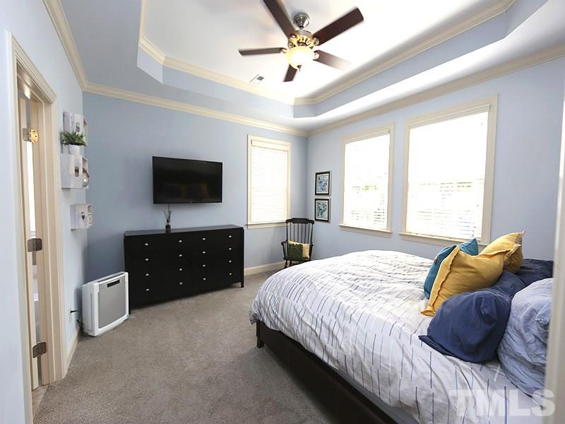 811 Chapanoke Road Raleigh, NC 27603 - Photo 9 of 25 a bedroom with a bed and a flat screen tv