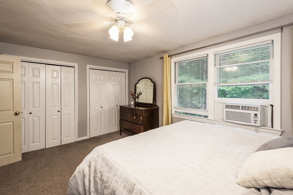 1 Spruce Tree Lane, Unit 3 Norton, MA 02766 - Photo 11 of 18 a bedroom with a bed and a large window with outer view
