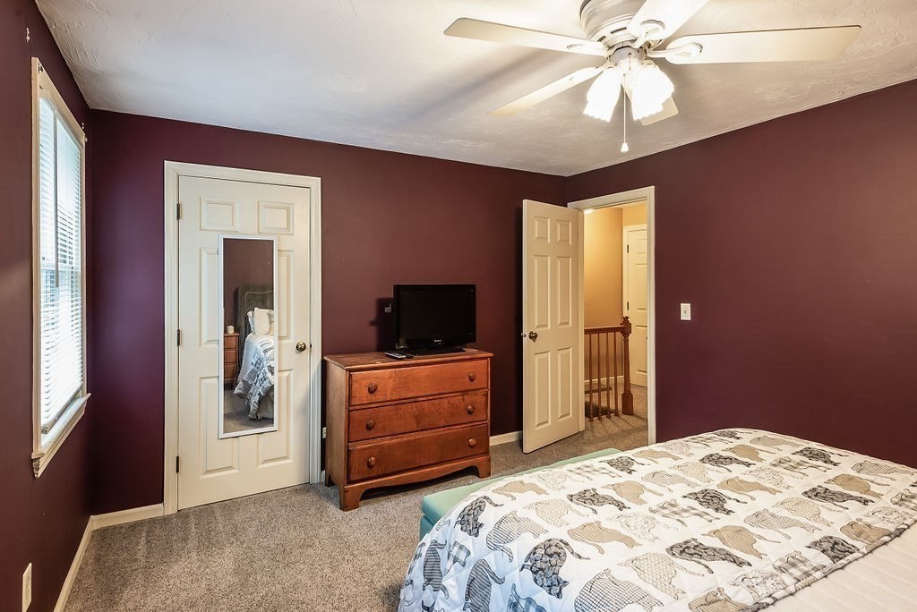 1 Spruce Tree Lane, Unit 3 Norton, MA 02766 - Photo 12 of 18 a bedroom with a bed and a flat screen tv