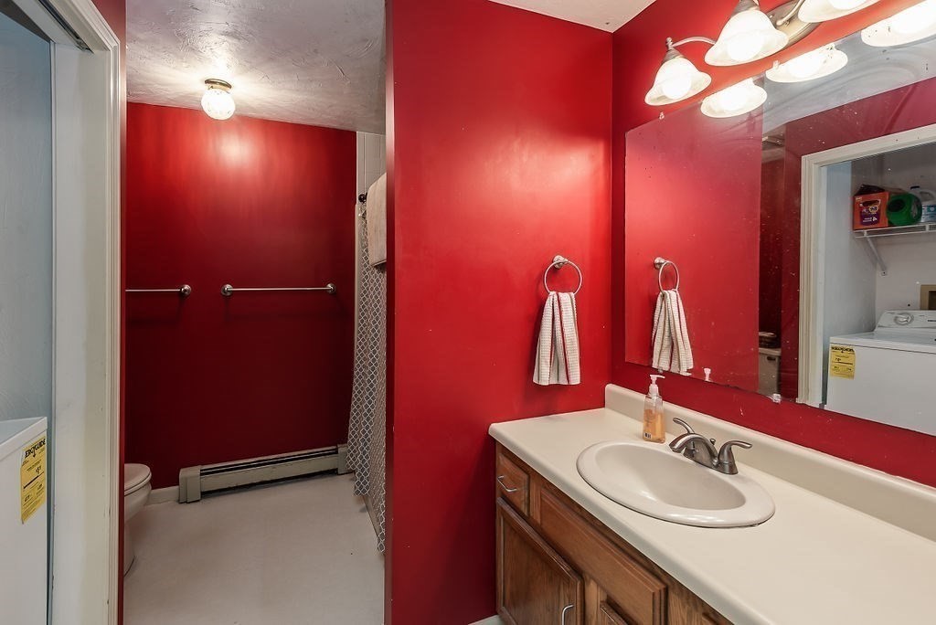 1 Spruce Tree Lane, Unit 3 Norton, MA 02766 - Photo 14 of 18 a bathroom with a sink and a mirror