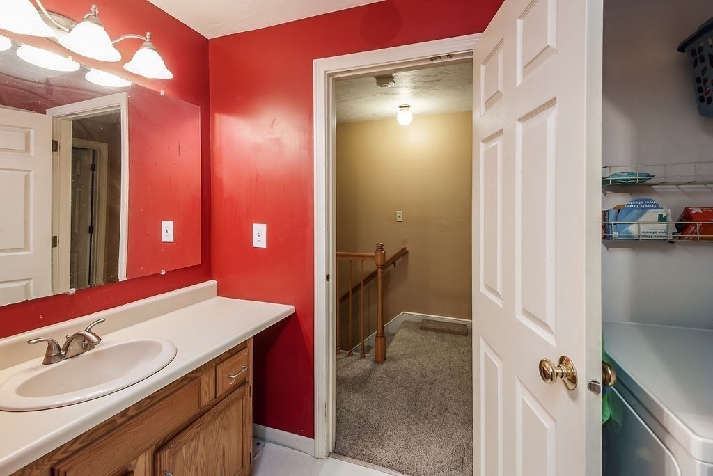 1 Spruce Tree Lane, Unit 3 Norton, MA 02766 - Photo 15 of 18 a bathroom with a sink a toilet and a mirror