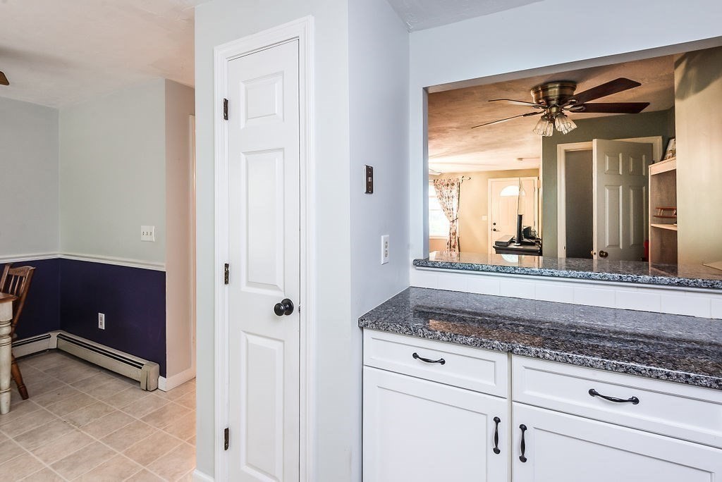 1 Spruce Tree Lane, Unit 3 Norton, MA 02766 - Photo 3 of 18 a view of a bathroom with a granite countertop sink mirror and vanity
