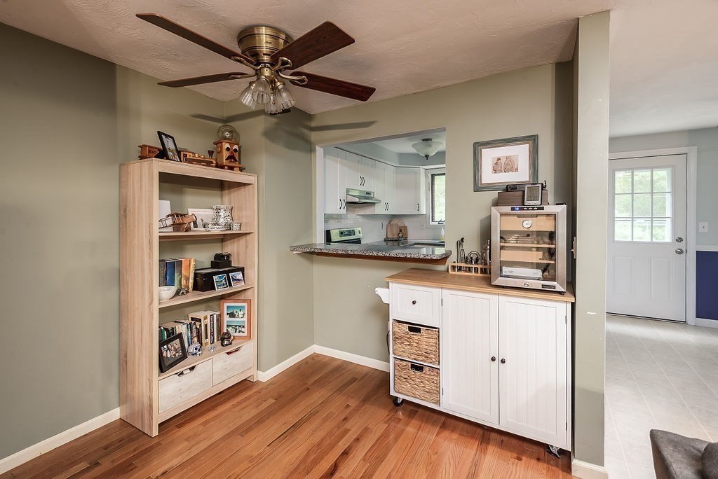 1 Spruce Tree Lane, Unit 3 Norton, MA 02766 - Photo 5 of 18 a kitchen with stainless steel appliances a cabinets and wooden floor