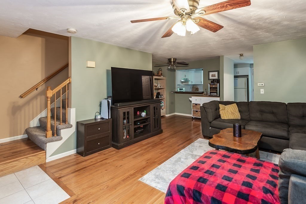 1 Spruce Tree Lane, Unit 3 Norton, MA 02766 - Photo 9 of 18 a living room with furniture and a flat screen tv