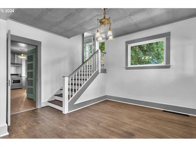 a view of an entryway with wooden floor