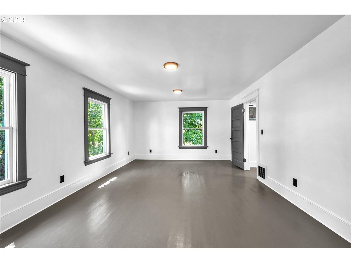 54886 Fullerton Road Scappoose, OR 97056 - Photo 24 of 42 a view of a room with window and wooden floor
