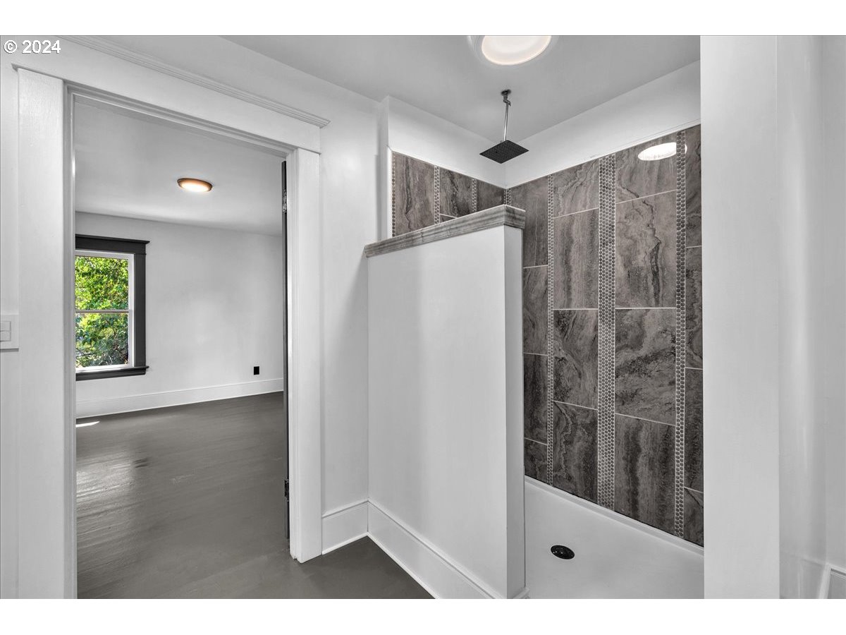 54886 Fullerton Road Scappoose, OR 97056 - Photo 28 of 42 a view of a bathroom with a shower and a sink