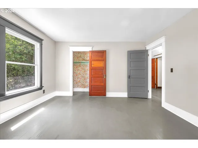 a view of bathroom with shower and wooden floor
