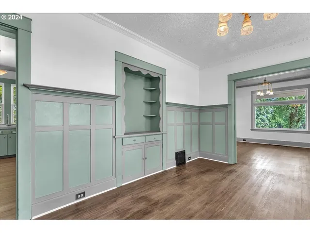a open kitchen with granite countertop a refrigerator