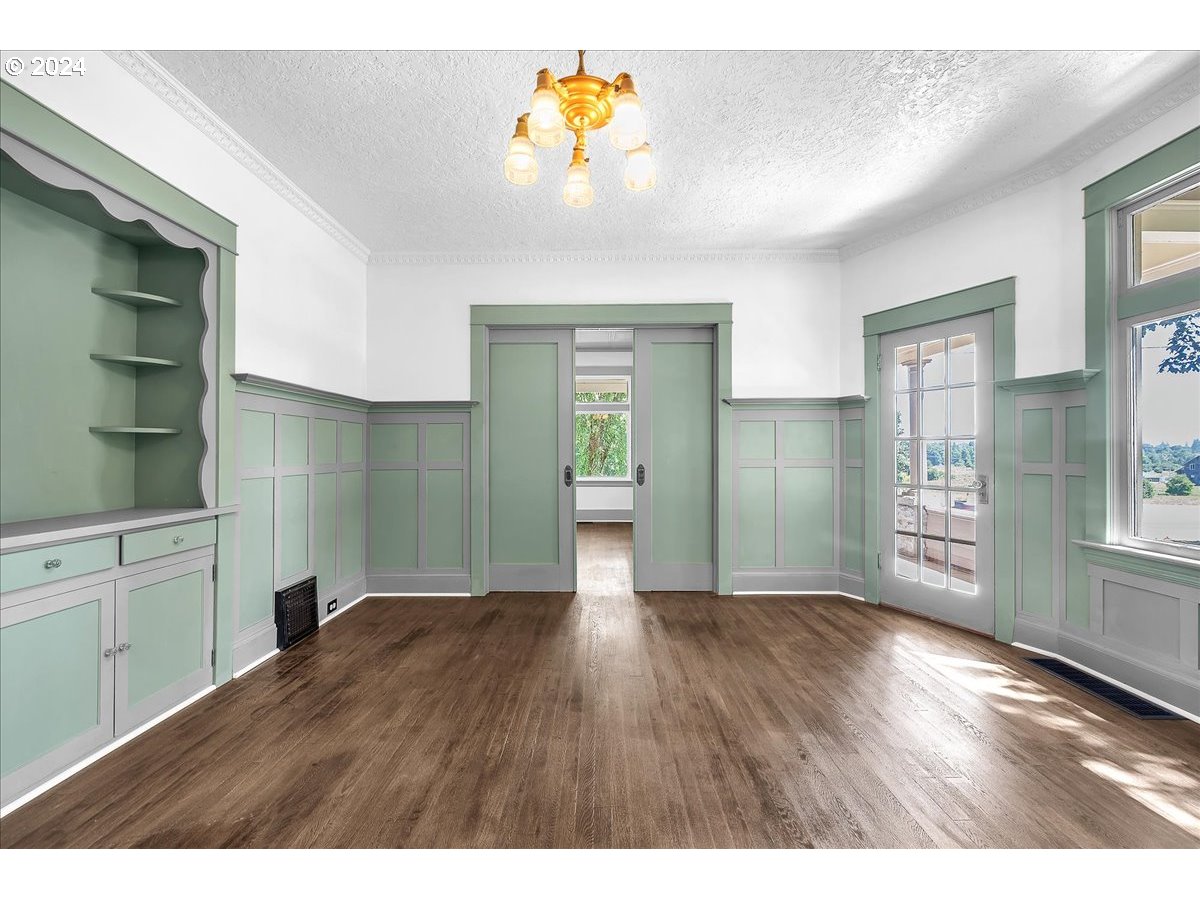 54886 Fullerton Road Scappoose, OR 97056 - Photo 8 of 42 a empty room with window and wooden floor