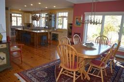 35 Ridge St Extension Wellfleet, MA 02667 - Photo 14 of 24 a kitchen with stainless steel appliances granite countertop a table and chairs