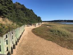 35 Ridge St Extension Wellfleet, MA 02667 - Photo 20 of 24 a view of an ocean with a house in background
