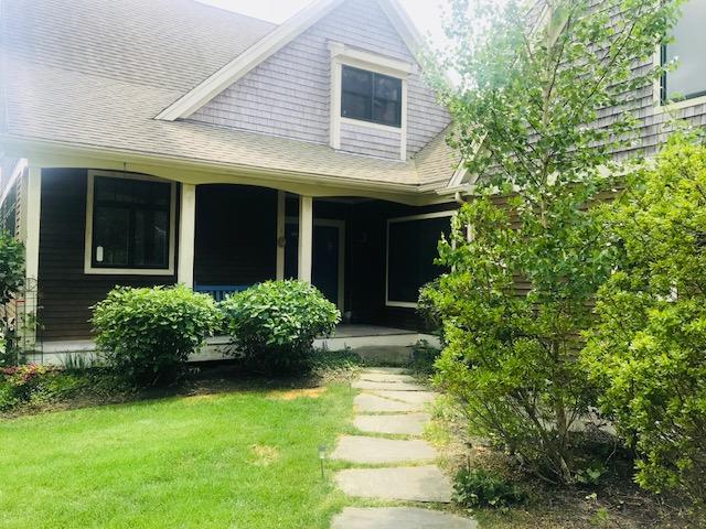 35 Ridge St Extension Wellfleet, MA 02667 - Photo 8 of 24 a front view of a house with garden