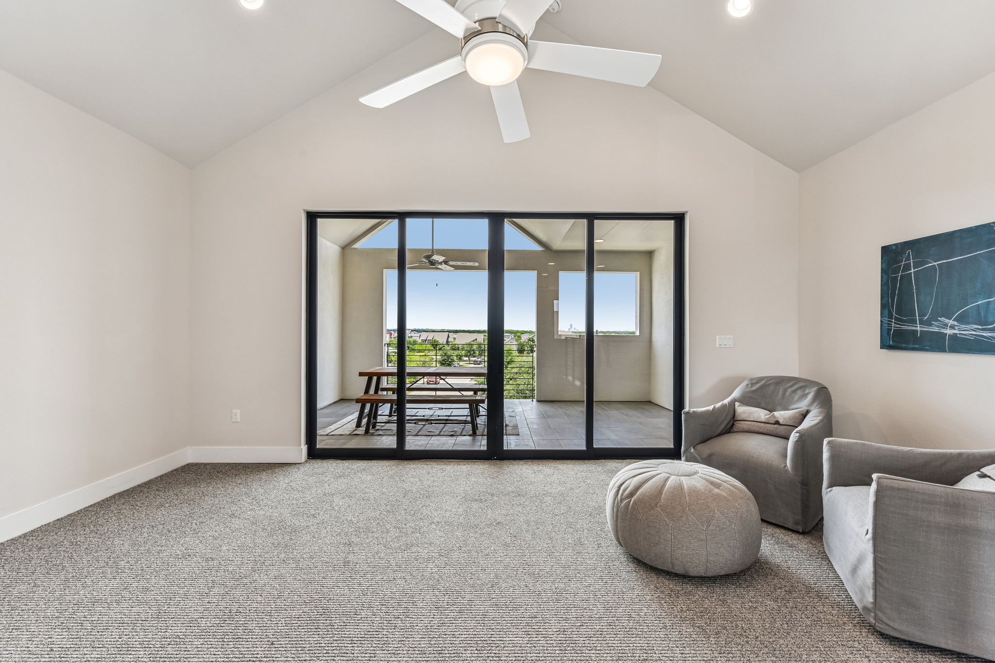 9033 Cattle Baron Path Austin, TX 78747 - Photo 27 of 40 A versatile bonus room boasts vaulted ceilings and direct access to an outdoor balcony.