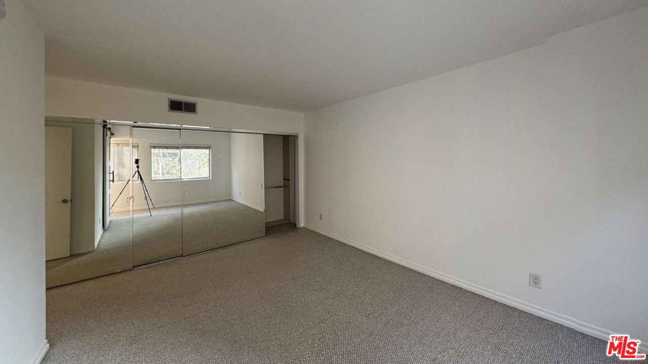 11750 Sunset Boulevard, Unit 317 Los Angeles, CA 90049 - Photo 6 of 11 a view of hallway with window