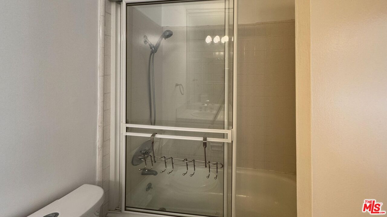 11750 Sunset Boulevard, Unit 317 Los Angeles, CA 90049 - Photo 10 of 11 a bathroom with a shower and toilet