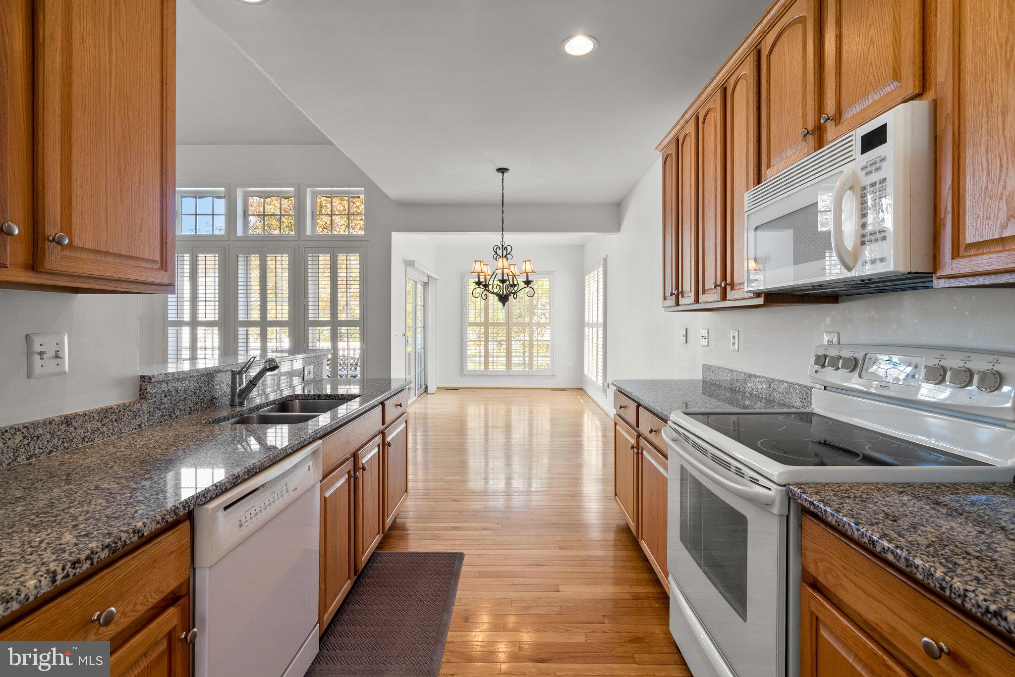 1256 Destiny Circle Annapolis, MD 21409 - Photo 12 of 49 a kitchen with stainless steel appliances granite countertop a sink stove and cabinets