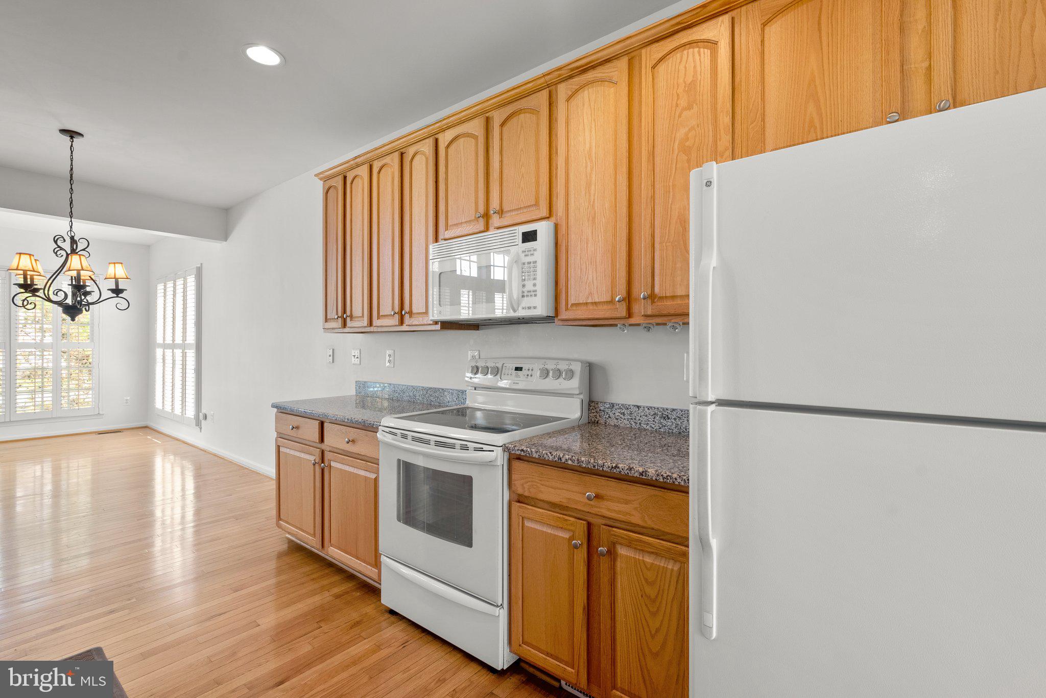 1256 Destiny Circle Annapolis, MD 21409 - Photo 13 of 49 a kitchen with stainless steel appliances granite countertop a refrigerator a stove a sink and a microwave