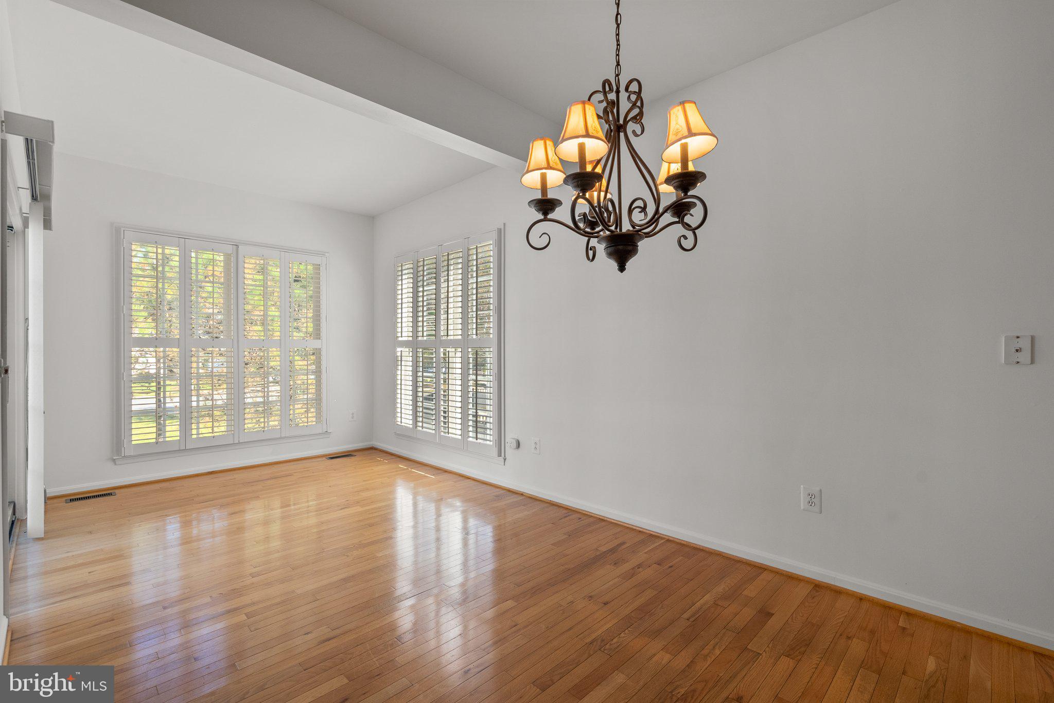1256 Destiny Circle Annapolis, MD 21409 - Photo 14 of 49 a view of a livingroom with a large window wooden floor and chandelier