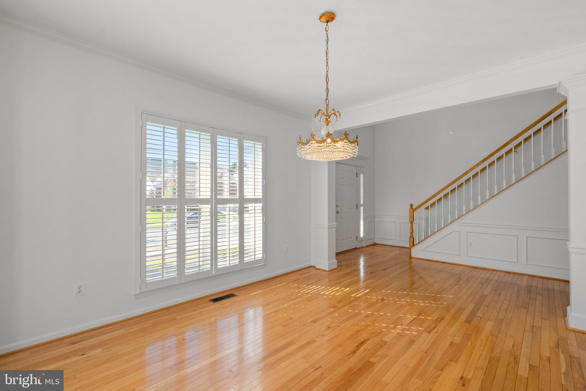 1256 Destiny Circle Annapolis, MD 21409 - Photo 18 of 49 a view of empty room with wooden floor and fan