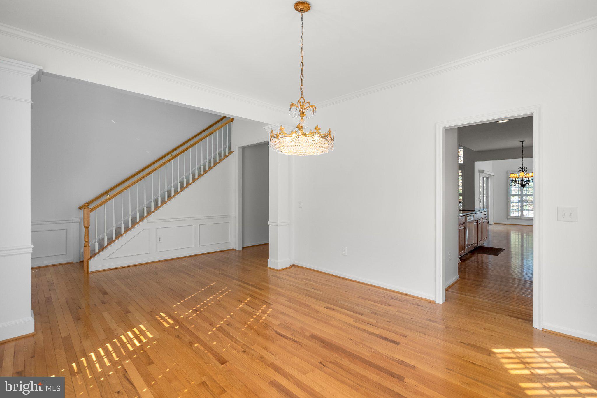 1256 Destiny Circle Annapolis, MD 21409 - Photo 19 of 49 a view of a room with wooden floor and staircase