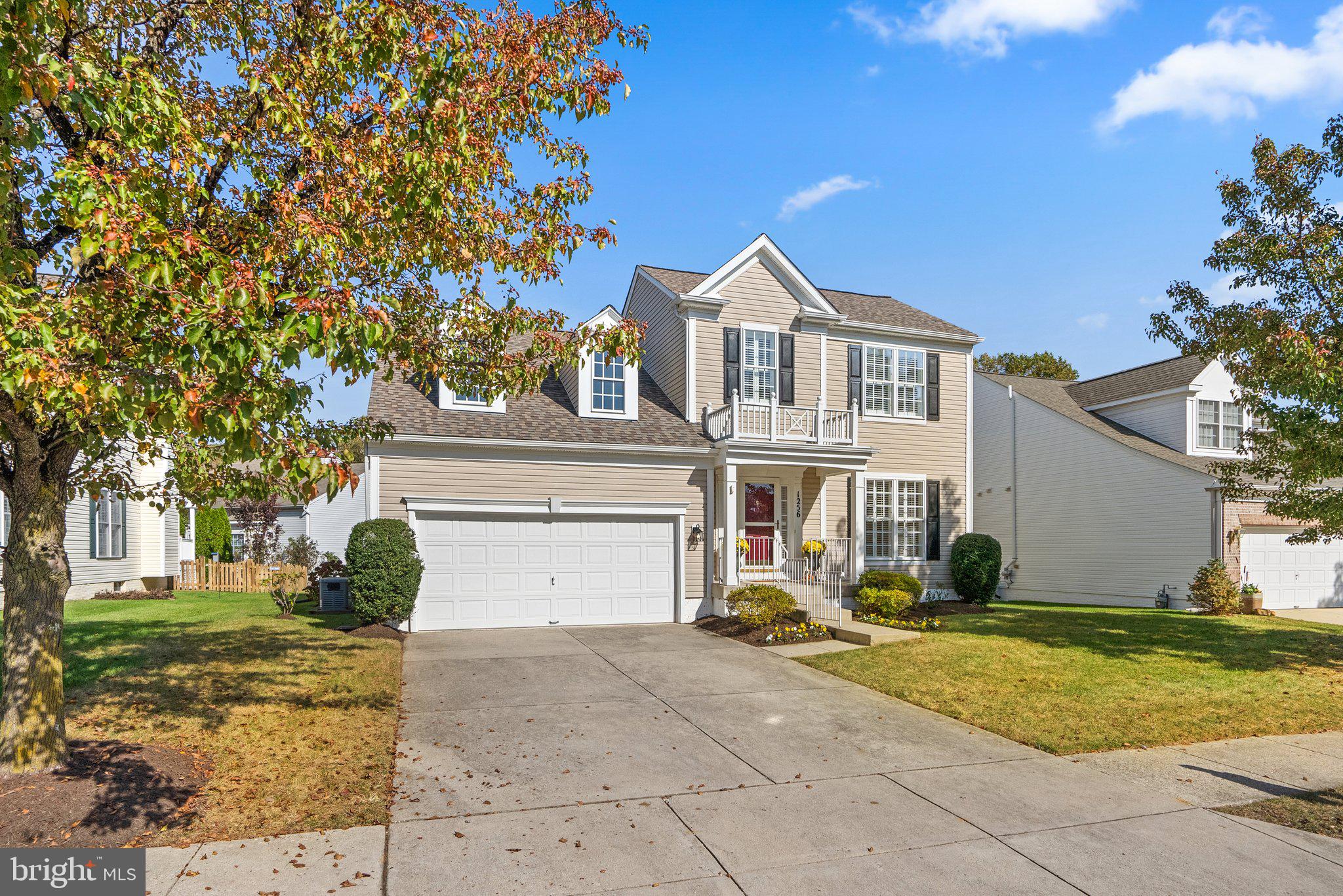 1256 Destiny Circle Annapolis, MD 21409 - Photo 2 of 49 a front view of a house with a yard