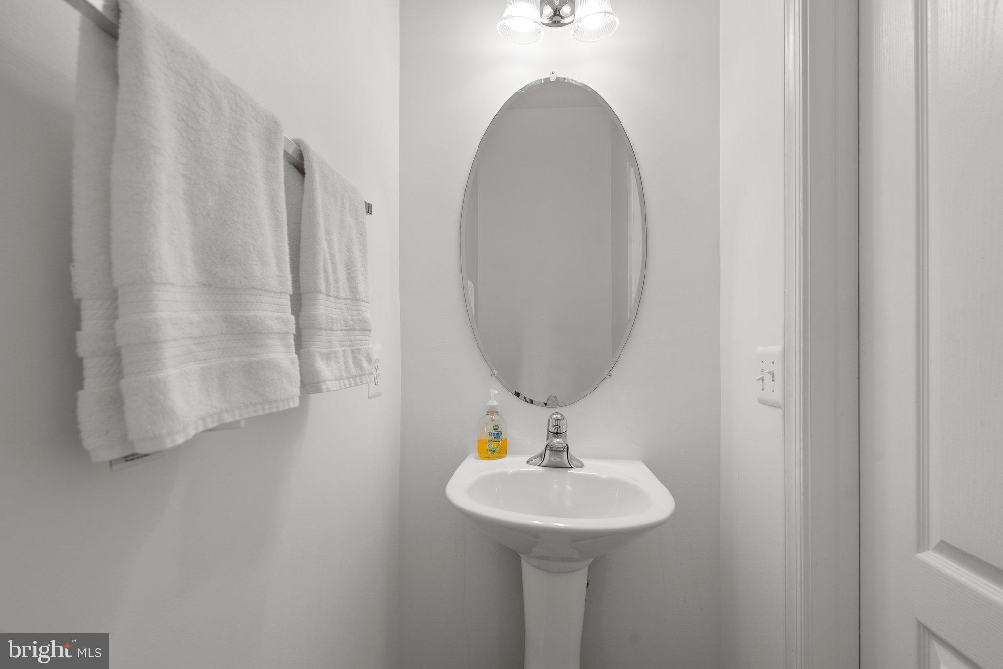 1256 Destiny Circle Annapolis, MD 21409 - Photo 21 of 49 a bathroom with a sink a mirror and vanity