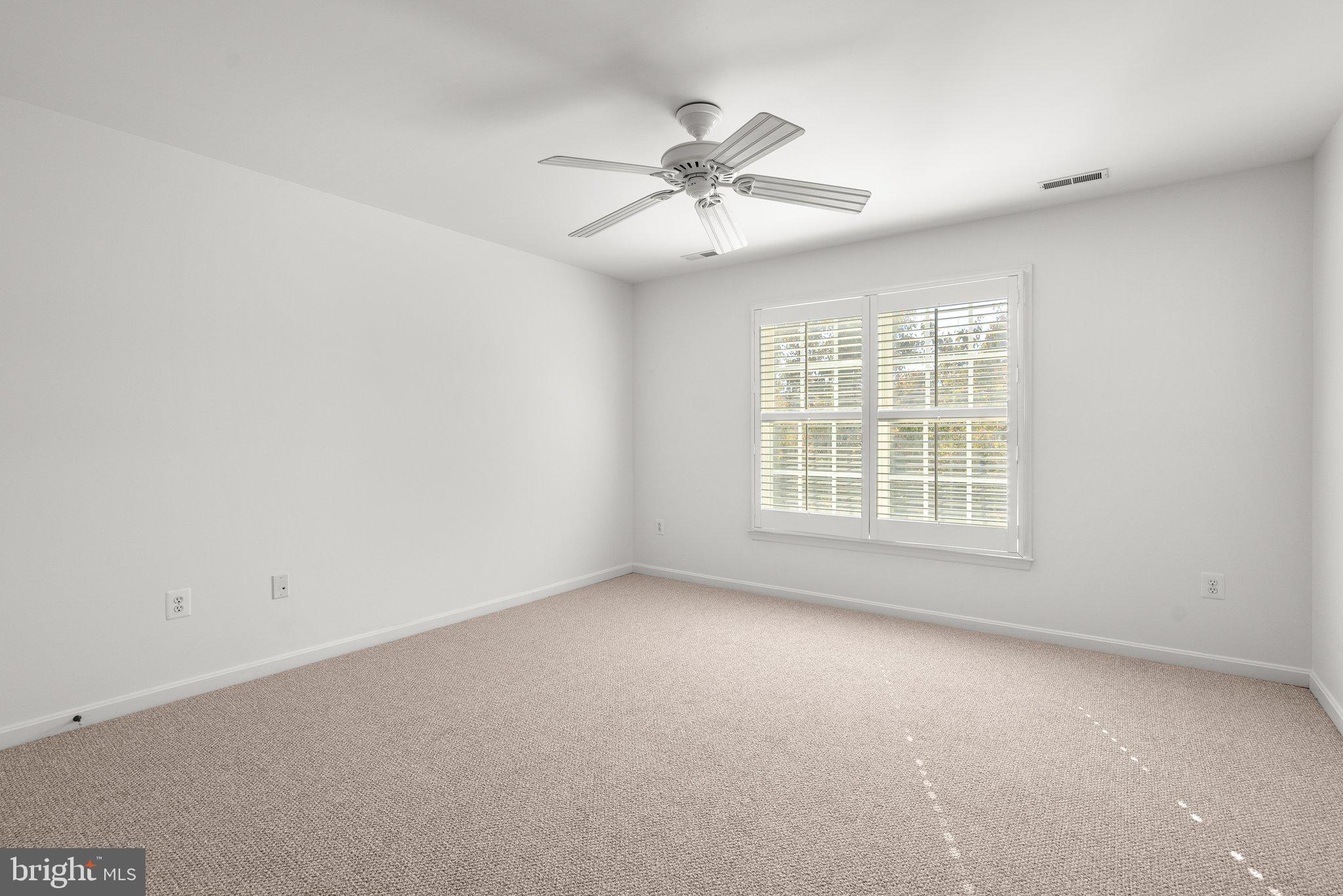 1256 Destiny Circle Annapolis, MD 21409 - Photo 32 of 49 an empty room with windows and fan