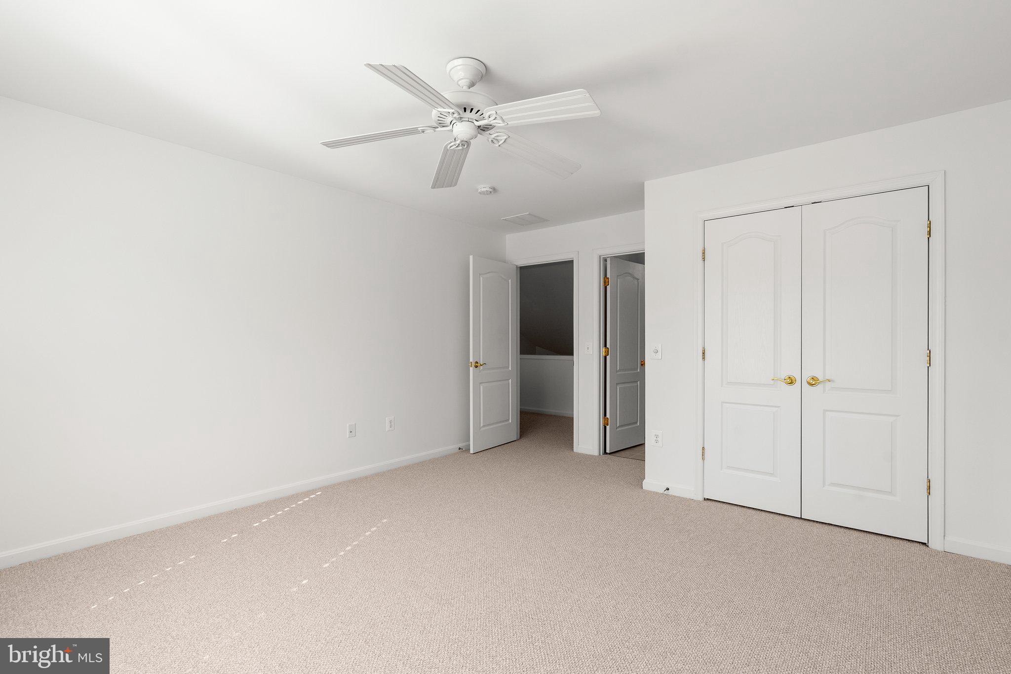 1256 Destiny Circle Annapolis, MD 21409 - Photo 33 of 49 a view of an empty room with a ceiling fan