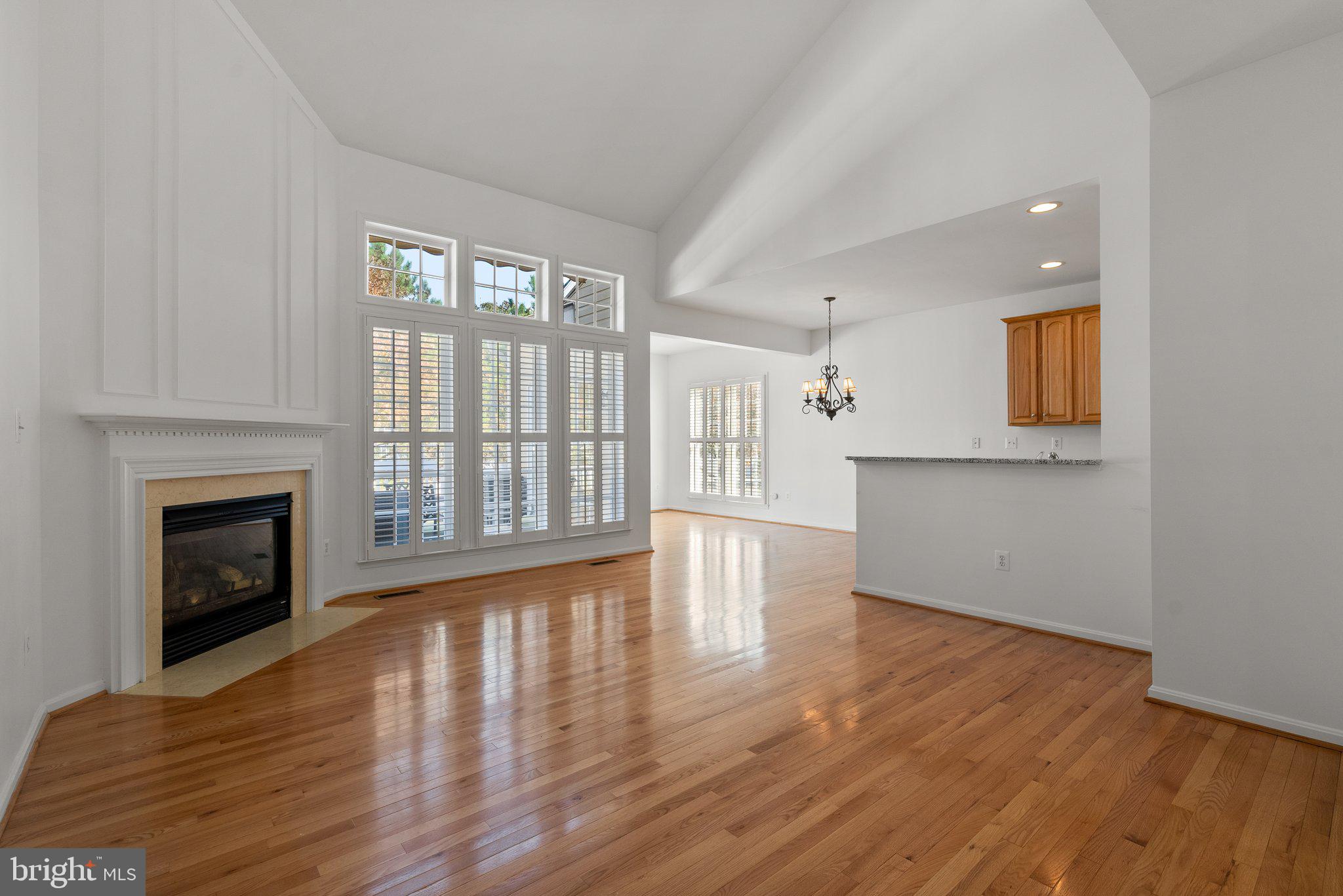 1256 Destiny Circle Annapolis, MD 21409 - Photo 4 of 49 a view of an empty room with wooden floor and a window
