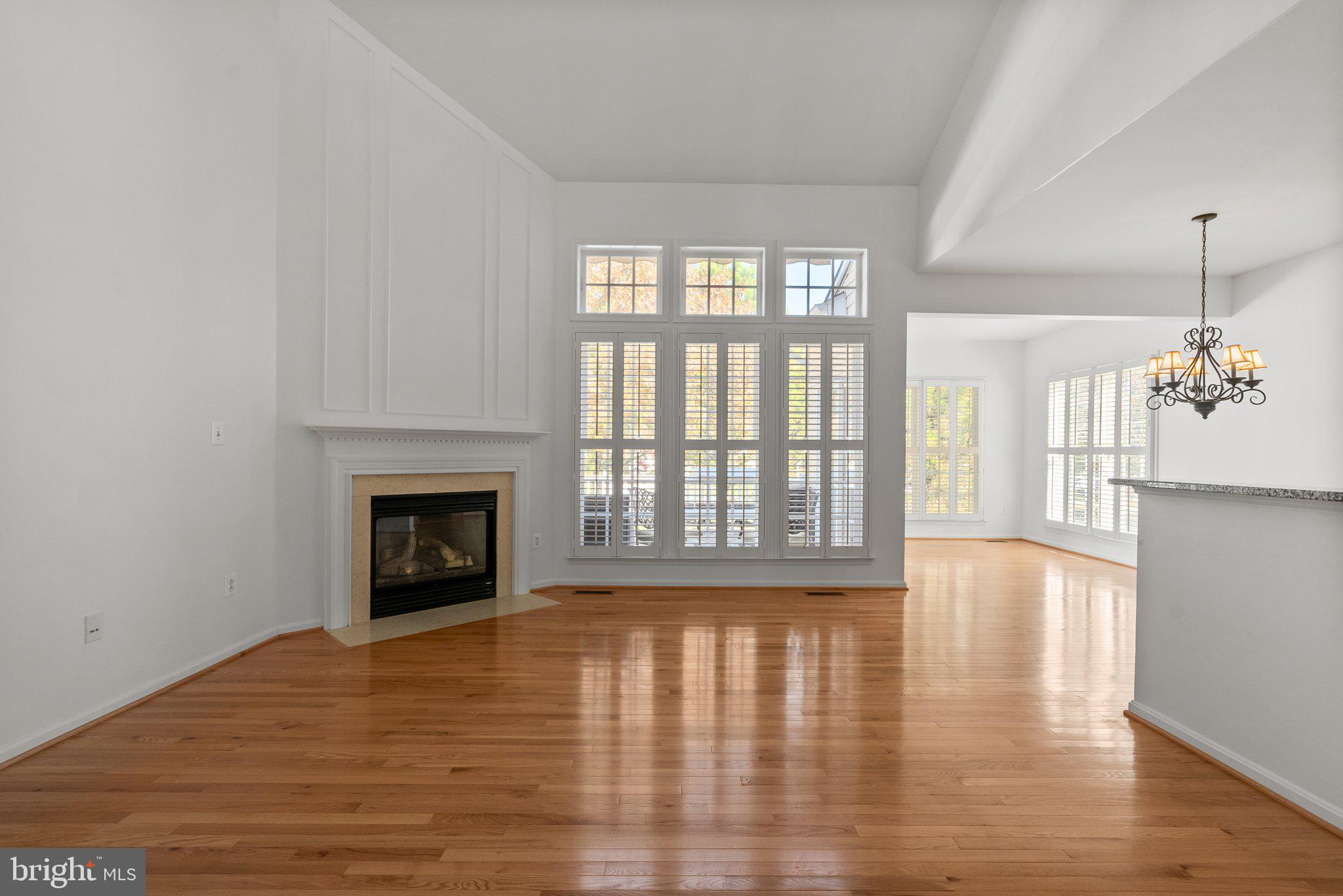 1256 Destiny Circle Annapolis, MD 21409 - Photo 6 of 49 a view of an empty room with window and wooden floor