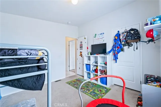 a bathroom with a sink and mirror with toilet