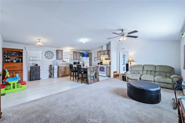 a living room with furniture and white walls