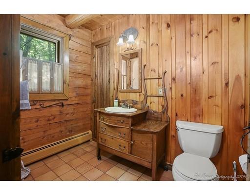 29 Spring Hill Road Newbury, MA 01922 - Photo 24 of 32 a bathroom with a toilet a sink and mirror